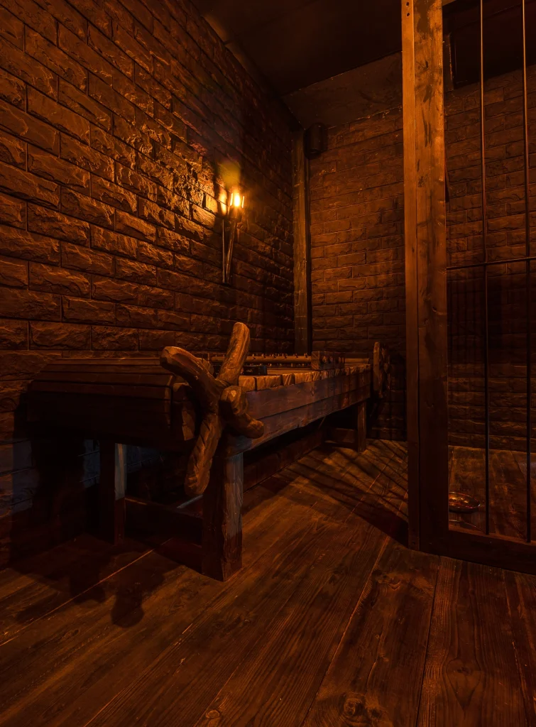 torture table puzzle next to a cage
