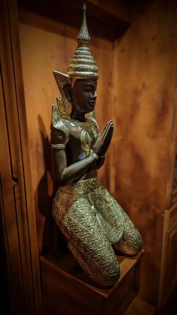 hidden door with a Buddha statue on it